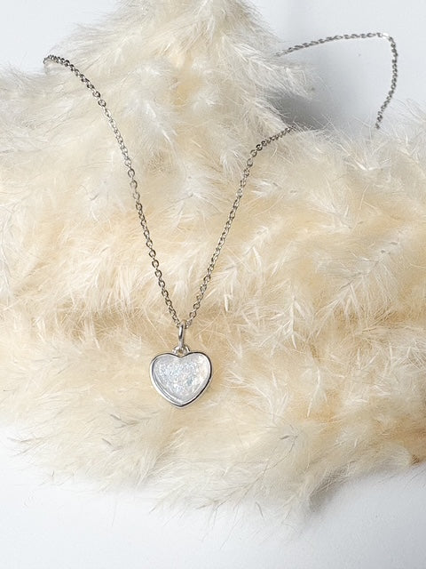 Custom memorial jewelry with ashes inclusion